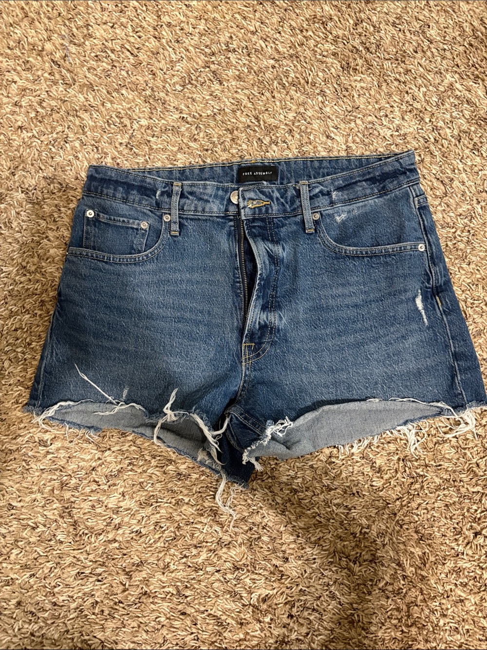 High-Rise Distressed Denim Shorts in Dark Blue